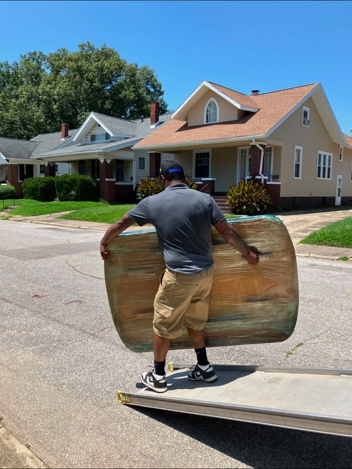 Ready Now Anytime crew carrying furniture outside
