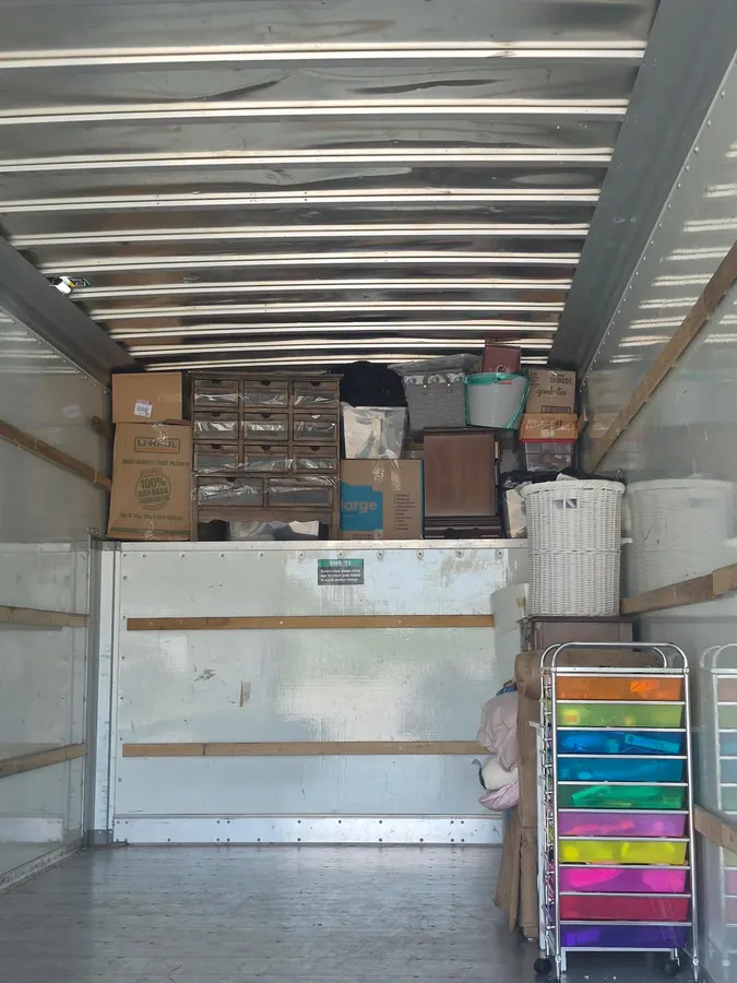 Ready Now Anytime team carefully moving household items