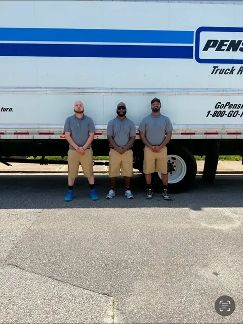 Ready Now Anytime moving crew standing beside a moving truck